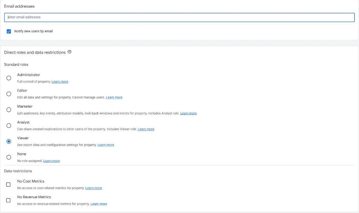 The GA4 Add roles and data restrictions panel showing all five standard roles plus the two data restrictions